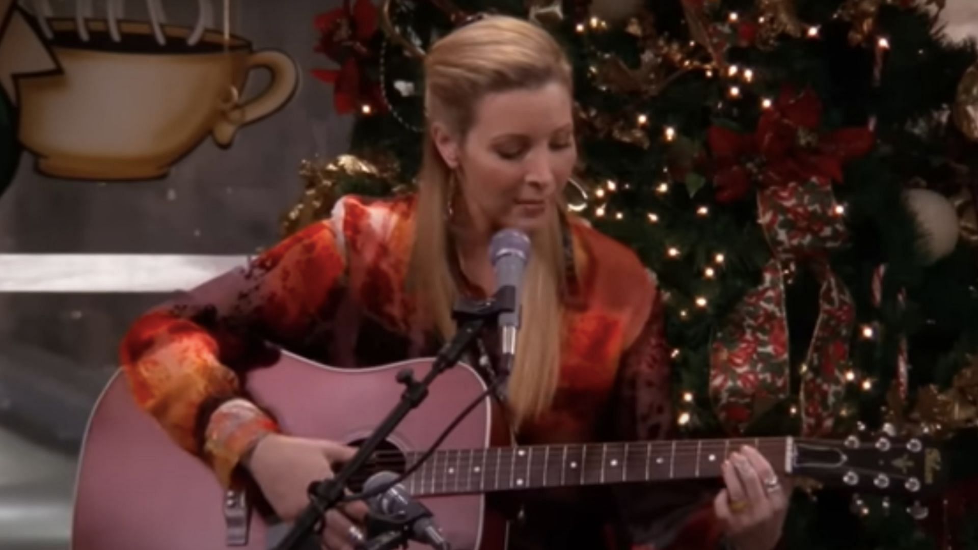 Phoebe sings her Christmas song for the gang (Image via YouTube/Friends)
